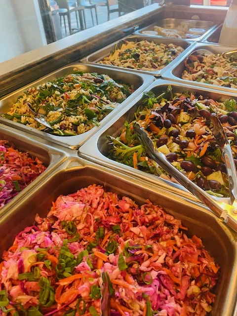 The counter, fresh salads on display