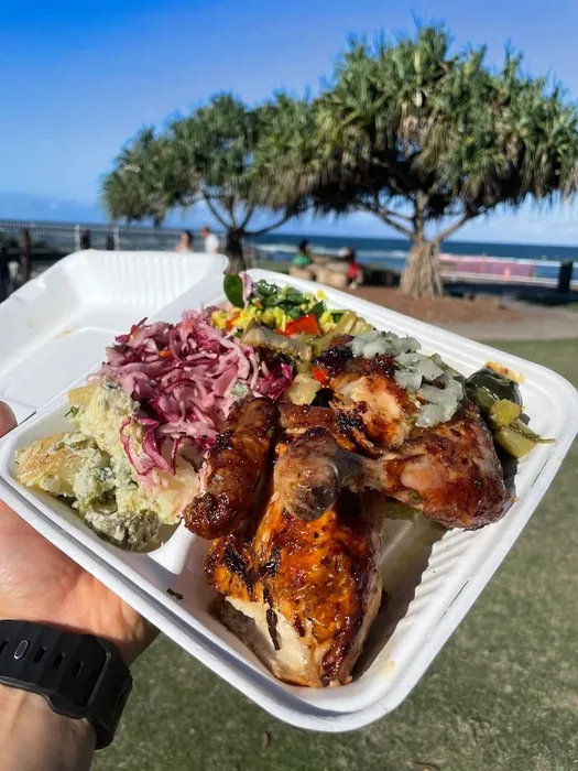 Creole chicken and salads at the beach